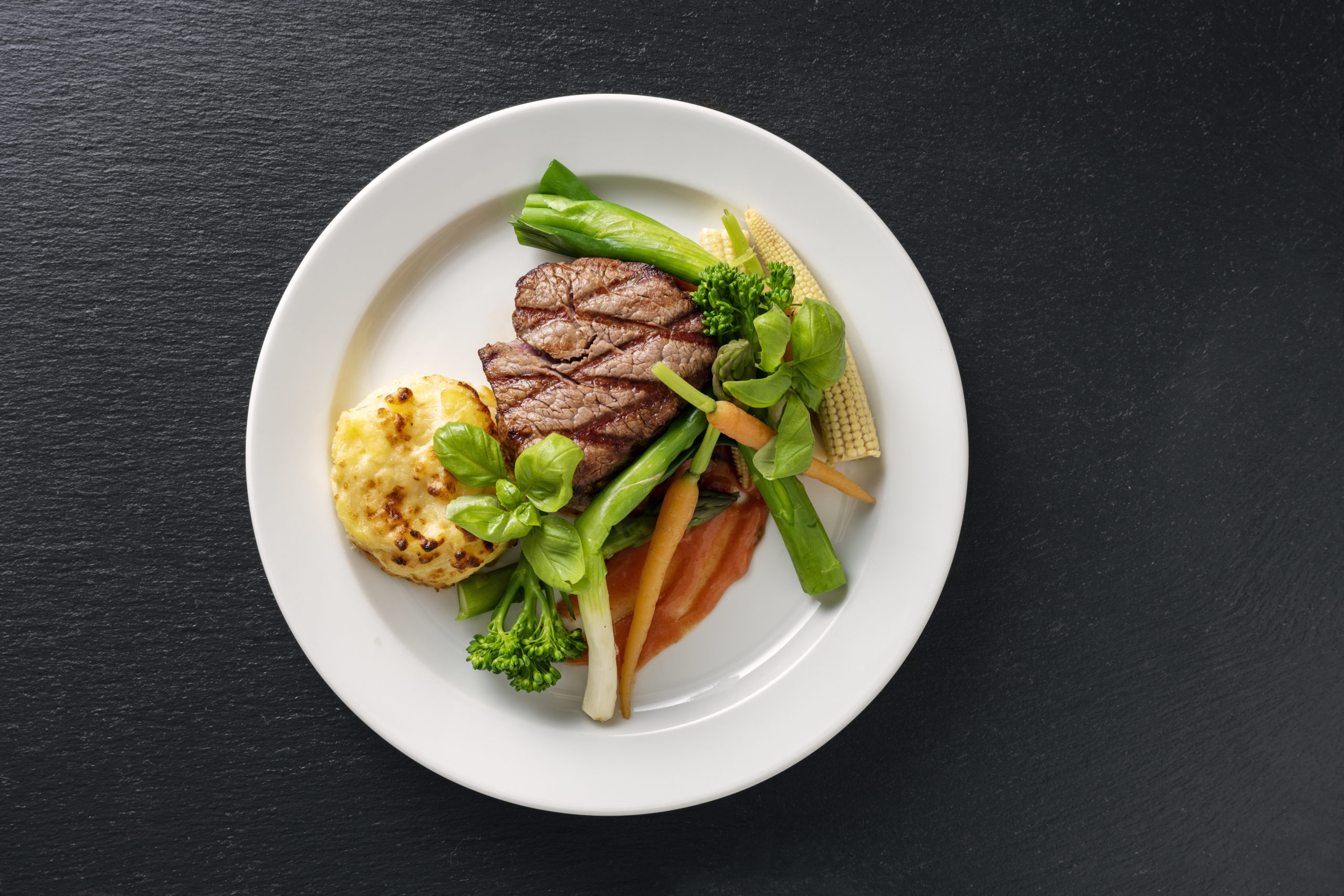 Veal tenderloin with sesonal vegetables.